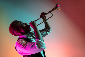 Image showing African American jazz musician playing trumpet.