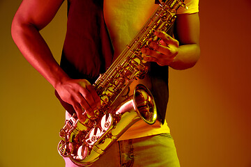 Image showing African American jazz musician playing the saxophone.