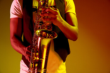 Image showing African American jazz musician playing the saxophone.