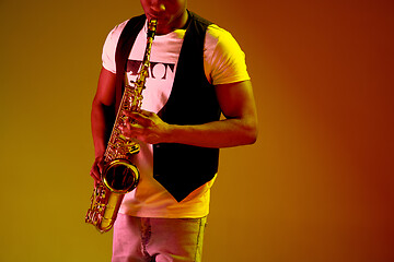 Image showing African American jazz musician playing the saxophone.