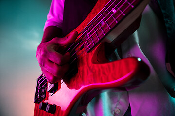 Image showing African American jazz musician playing bass guitar.