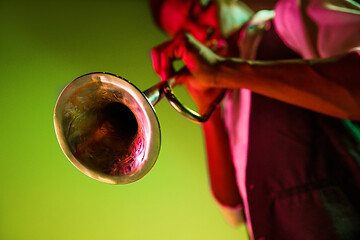 Image showing African American jazz musician playing trumpet.