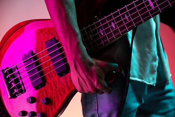 Image showing African American jazz musician holding bass guitar.