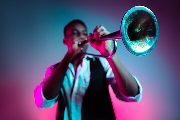 Image showing African American jazz musician playing trumpet.