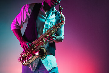 Image showing African American jazz musician playing the saxophone.