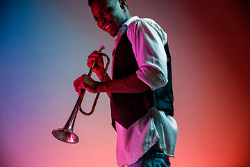 Image showing African American jazz musician playing trumpet.