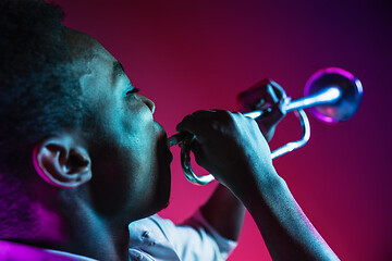 Image showing African American jazz musician playing trumpet.