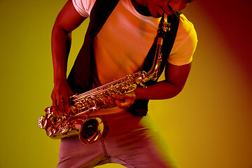 Image showing African American jazz musician playing the saxophone.