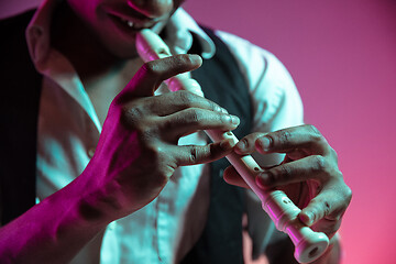 Image showing African American jazz musician playing pipe.