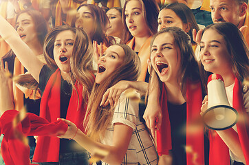 Image showing Group of happy fans are cheering for their team victory.