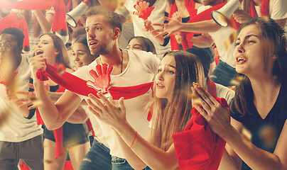 Image showing Group of happy fans are cheering for their team victory.