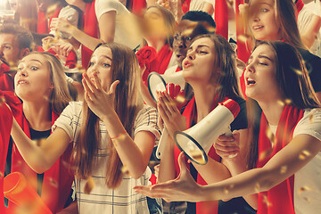 Image showing Group of happy fans are cheering for their team victory.