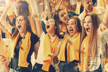 Image showing Group of happy fans are cheering for their team victory.