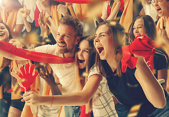 Image showing Group of happy fans are cheering for their team victory.