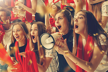 Image showing Group of happy fans are cheering for their team victory.