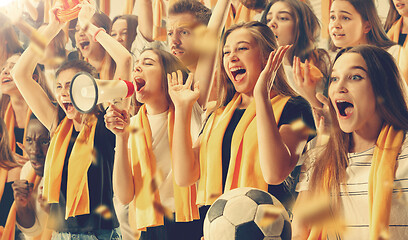 Image showing Group of happy fans are cheering for their team victory.