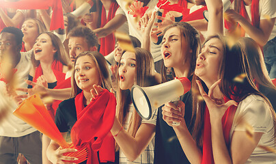 Image showing Group of happy fans are cheering for their team victory.