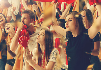 Image showing Group of happy fans are cheering for their team victory.