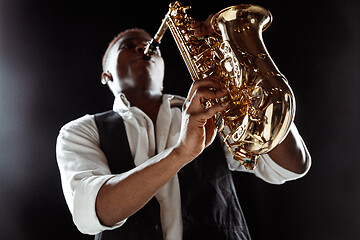 Image showing African American jazz musician playing the saxophone.