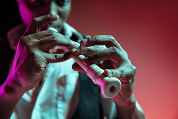 Image showing African American jazz musician playing pipe.