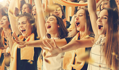 Image showing Group of happy fans are cheering for their team victory.