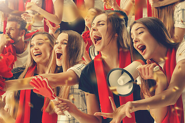 Image showing Group of happy fans are cheering for their team victory.