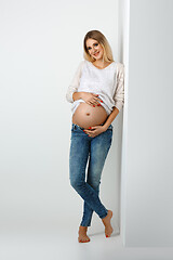 Image showing Beautiful pregnant woman in jeans