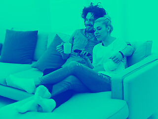 Image showing Young couple on the sofa watching television