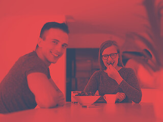 Image showing couple enjoying morning coffee and strawberries