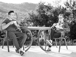 Image showing couple enjoying morning coffee and breakfast