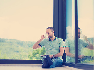 Image showing man on the floor enjoying relaxing lifestyle