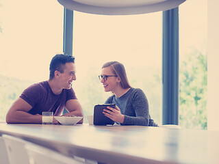 Image showing couple enjoying morning coffee and strawberries