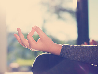 Image showing young woman doing morning yoga exercises