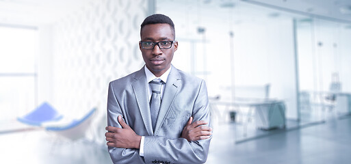 Image showing Young businessman in his office