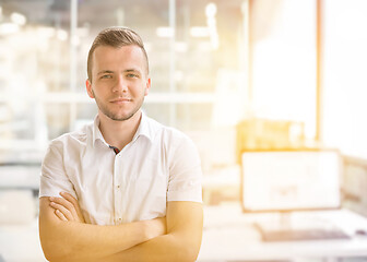 Image showing Young businessman in his office