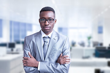 Image showing Young businessman in his office