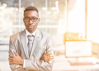 Image showing Young businessman in his office