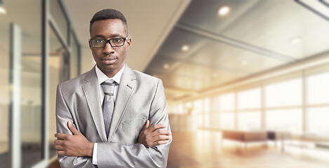 Image showing Young businessman in his office