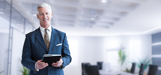 Image showing Senior businessman in his office