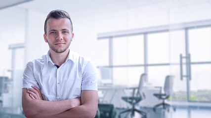 Image showing Young businessman in his office