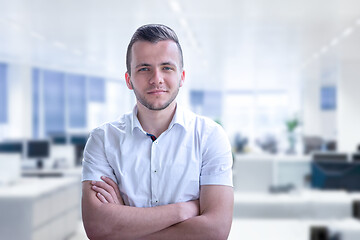 Image showing Young businessman in his office