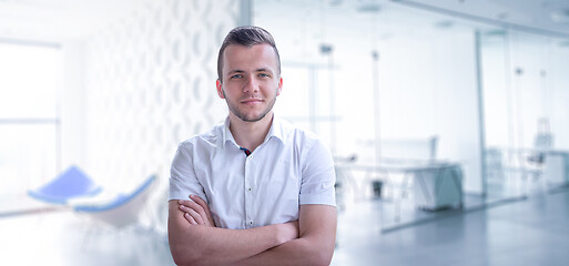 Image showing Young businessman in his office