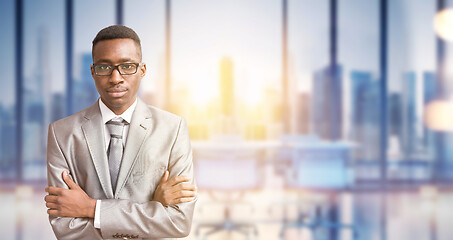 Image showing Young businessman in his office