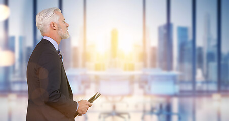 Image showing Senior businessman in his office