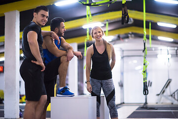 Image showing athletes working out  jumping on fit box