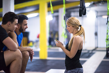 Image showing athletes working out  jumping on fit box