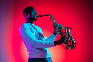 Image showing African American jazz musician playing the saxophone.