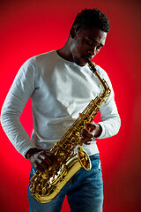 Image showing African American jazz musician playing the saxophone.