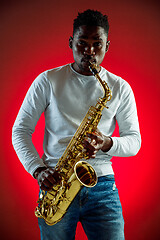 Image showing African American jazz musician playing the saxophone.