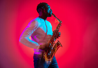 Image showing African American jazz musician playing the saxophone.